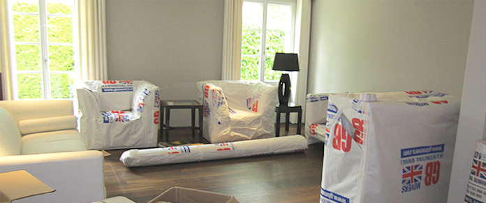 Specialist packing services - packed living room, Geneva